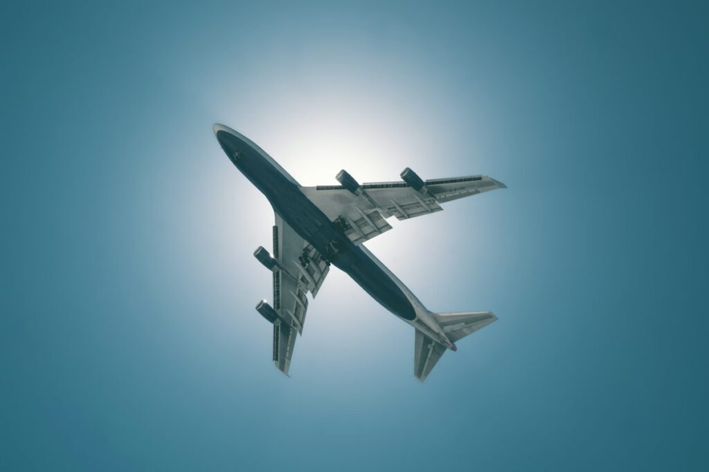 Airplane flying view with round trip ticket 